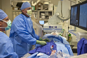 UC Irvine interventional radiologist Dr. Scott Goodwin performs an embolization procedure. 